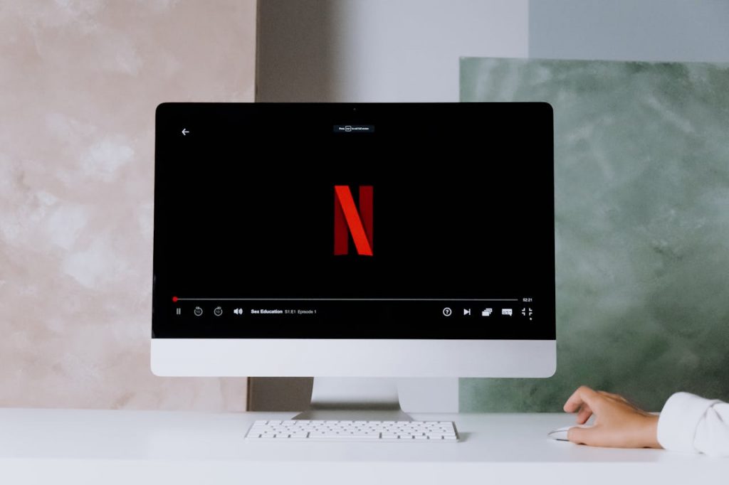 pexels-photo-5082567 A minimalist workspace scene featuring a desktop displaying a streaming service, ideal for modern lifestyle themes.